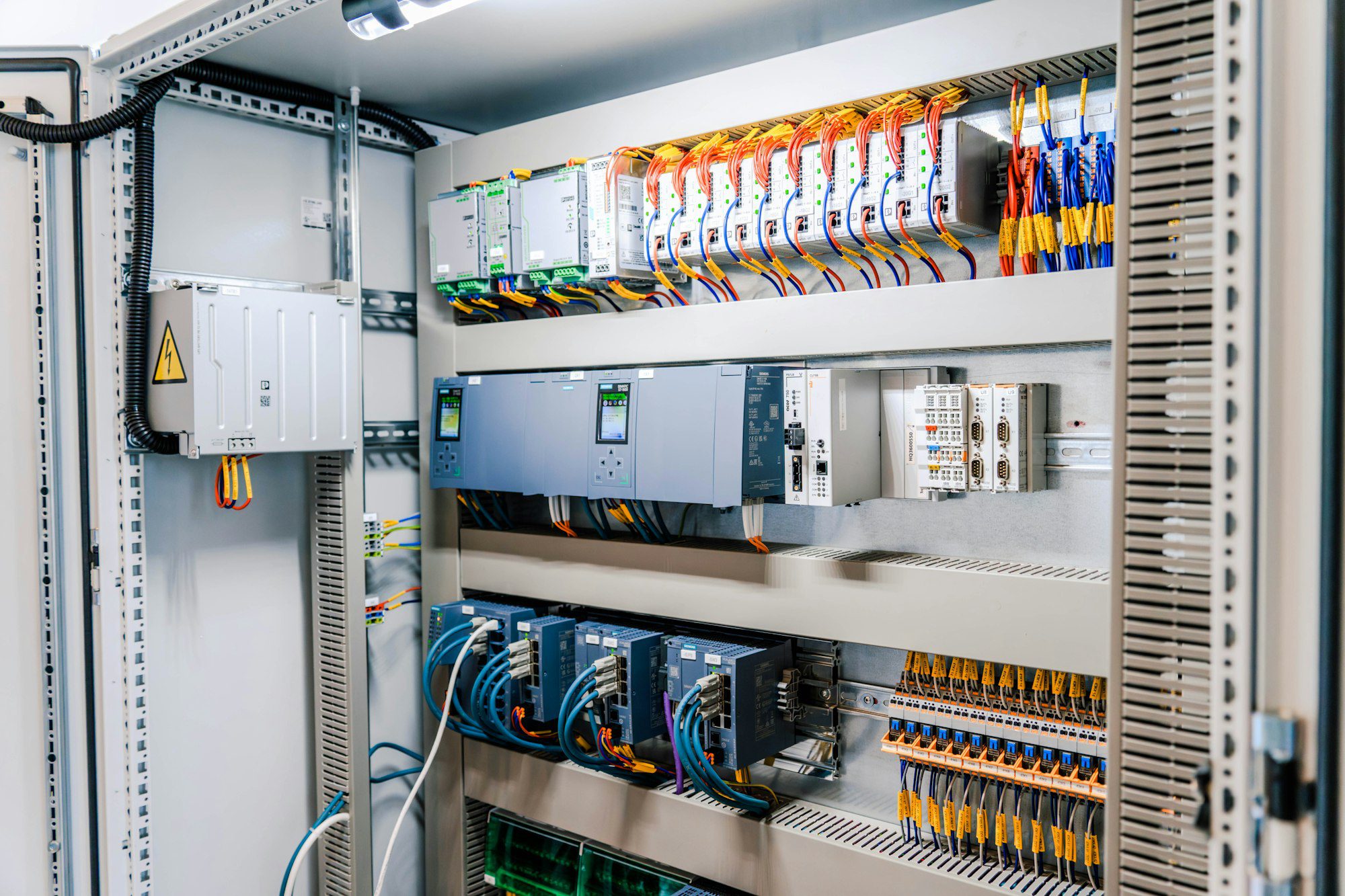 Open industrial electrical cabinet, controllers and wiring